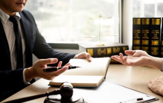 Attorney meeting with a client during an initial legal consultation in Scranton, reviewing documents and discussing case strategy.