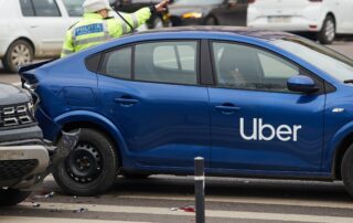 Uber vehicle involved in a collision with police directing traffic, illustrating limited tort insurance issues in a Scranton rideshare accident.