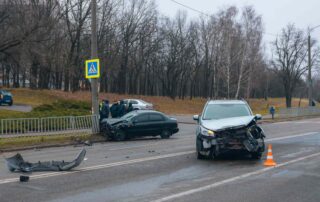 Two damaged vehicles after a collision, illustrating a Scranton car accident where fault may be shared between drivers.