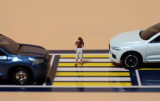 A symbolic representation of a pedestrian in a vulnerable position, illustrating how your own car insurance affects your pedestrian accident case through Pennsylvania's priority of benefits.