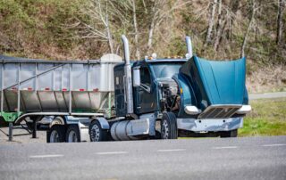 A broken-down semi-truck illustrating the critical need for a freight broker liability lawyer in PA to investigate if mechanical failures were caused by the negligent hiring of an unsafe carrier.