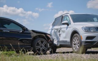 A white SUV and black sedan after a side-impact collision, representing the evidence used to prove pre-impact fear in Scranton survival actions.