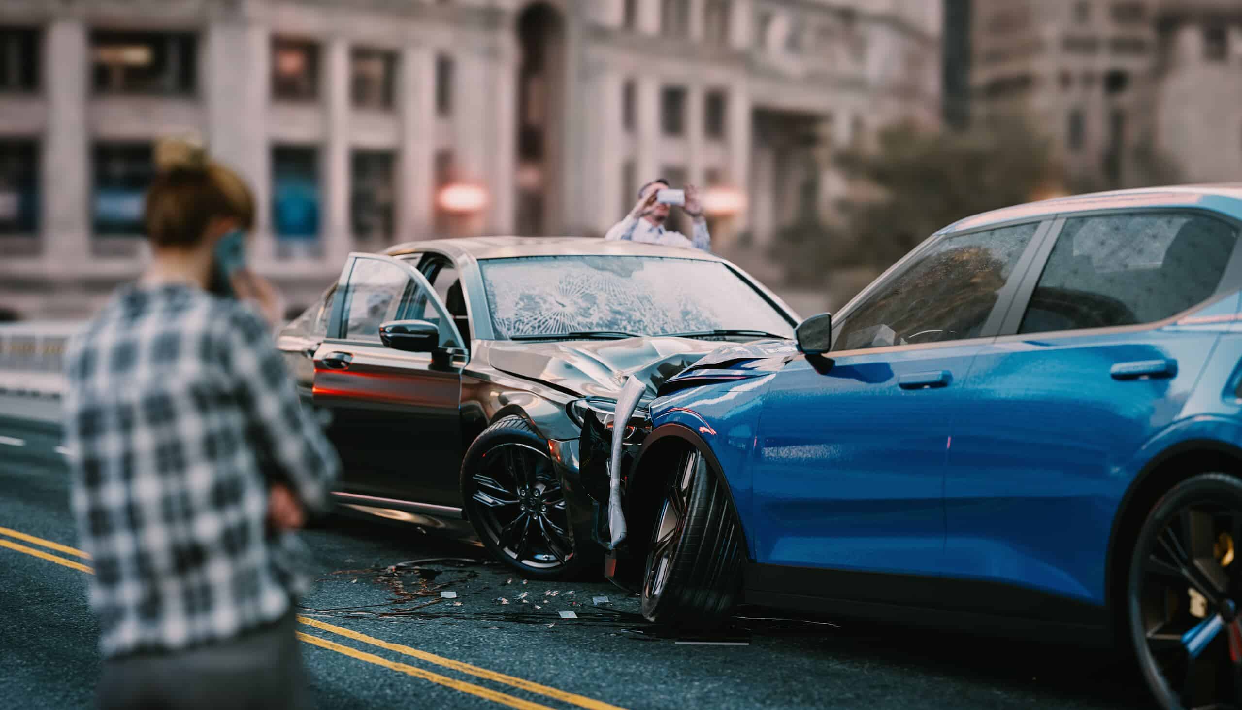 A head-on car accident on a city street with witnesses nearby, illustrating the emotional suffering and fear experienced before impact in Pennsylvania.