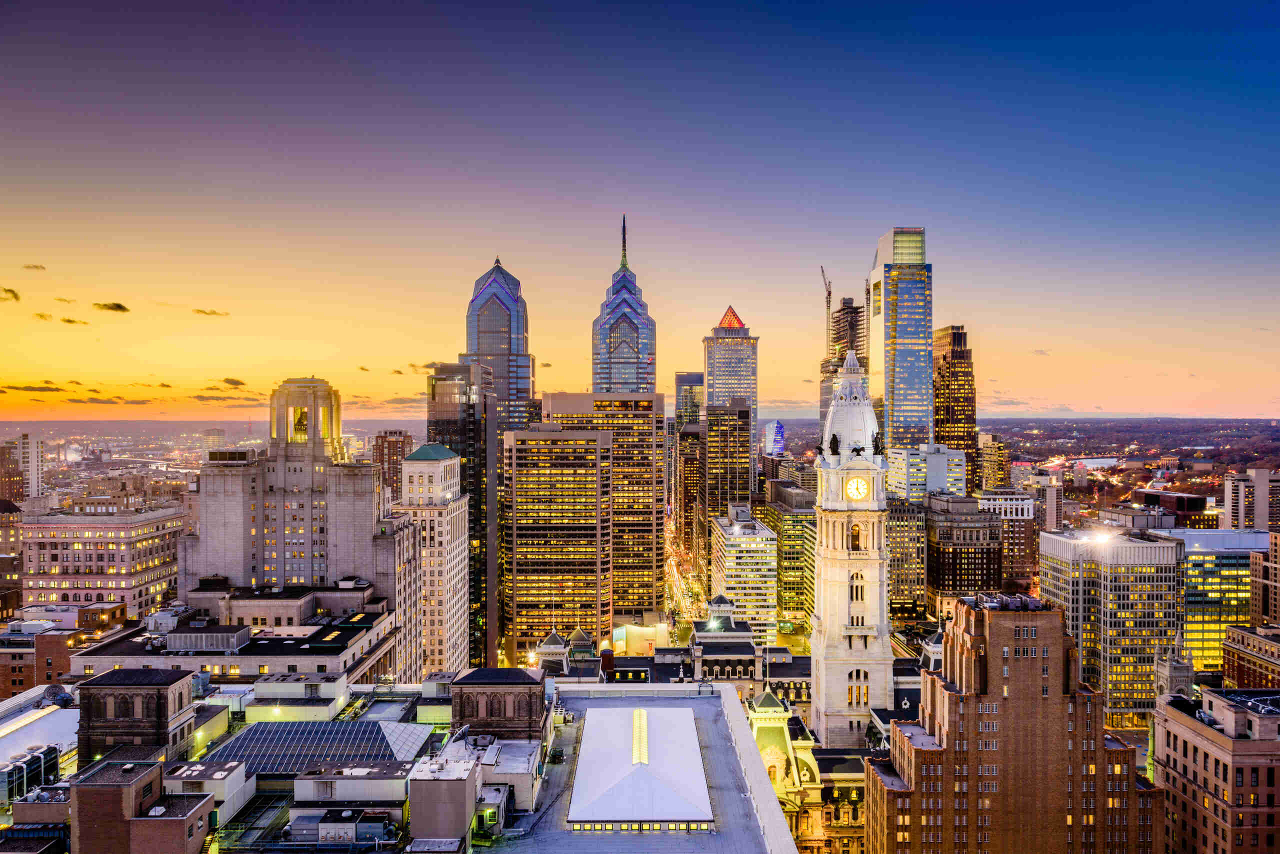 The Philadelphia skyline illuminated at dusk represents the legal services provided by Philadelphia Negligent Security Lawyers at The Slocum Firm.