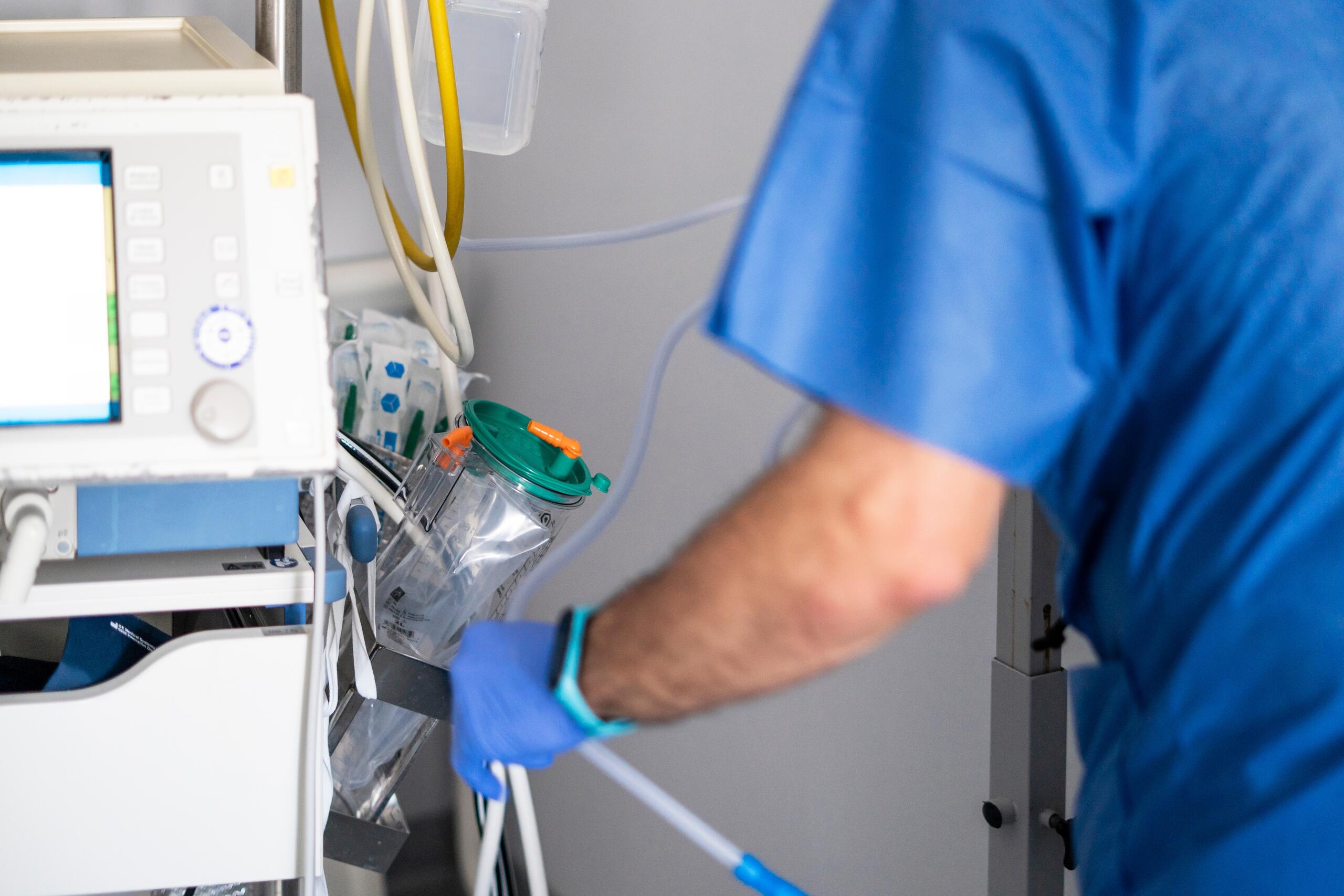 Medical professional adjusting hospital equipment for severe trauma cases represented by Pennsylvania spinal cord injury lawyers.